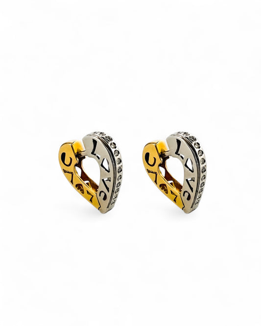 Comprar pendientes tipo criollas de oro bicolor  blanco y amarillo de 18kt de 1,9c.  La parte interior es calada con texto LOVE y la parte exterior lleva un carril de diamantes 