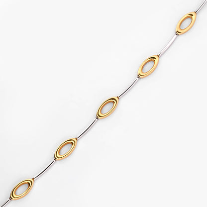 Comprar collar semirrígido realizado en oro blanco y amarillo de 18kt. Cierre de cajón y un brazo de seguridad. Joyería Compro Oro Barcelona. Ian'Or.