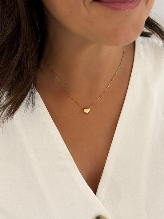 Comprar collar original de la firma Tous de oro amarillo de 18kt con cadena forzada y colgante en forma de corazón. Joyas Tous baratas. Envío gratis.


