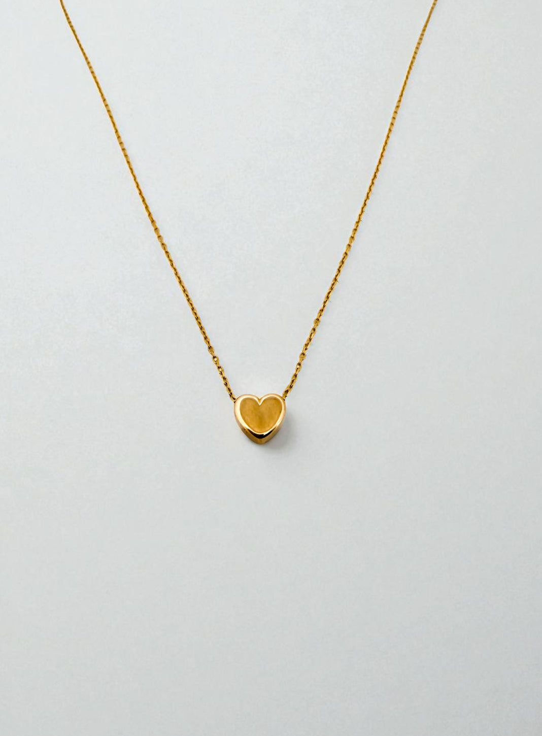 Comprar collar original de la firma Tous de oro amarillo de 18kt con cadena forzada y colgante en forma de corazón. Joyas Tous baratas. Envío gratis.

