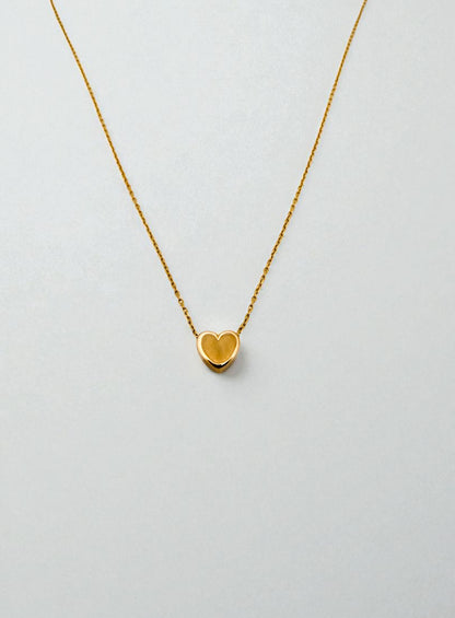 Comprar collar original de la firma Tous de oro amarillo de 18kt con cadena forzada y colgante en forma de corazón. Joyas Tous baratas. Envío gratis.

