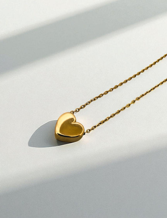 Comprar collar original de la firma Tous de oro amarillo de 18kt con cadena forzada y colgante en forma de corazón. Joyas Tous baratas. Envío gratis.

