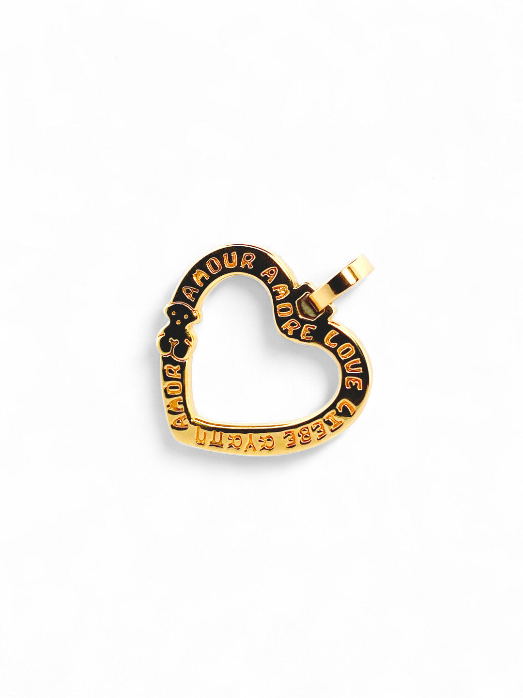 Comprar Colgante  TOUS en forma de corazón realizado en oro amarillo de 18kt. Congrabado del icónico osito de la marc  y la palabra Amor. Venta de joyas Tous segunda mano