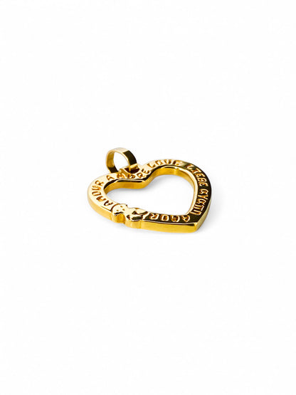 Comprar Colgante  TOUS en forma de corazón realizado en oro amarillo de 18kt. Congrabado del icónico osito de la marc  y la palabra Amor. Venta de joyas Tous segunda mano
