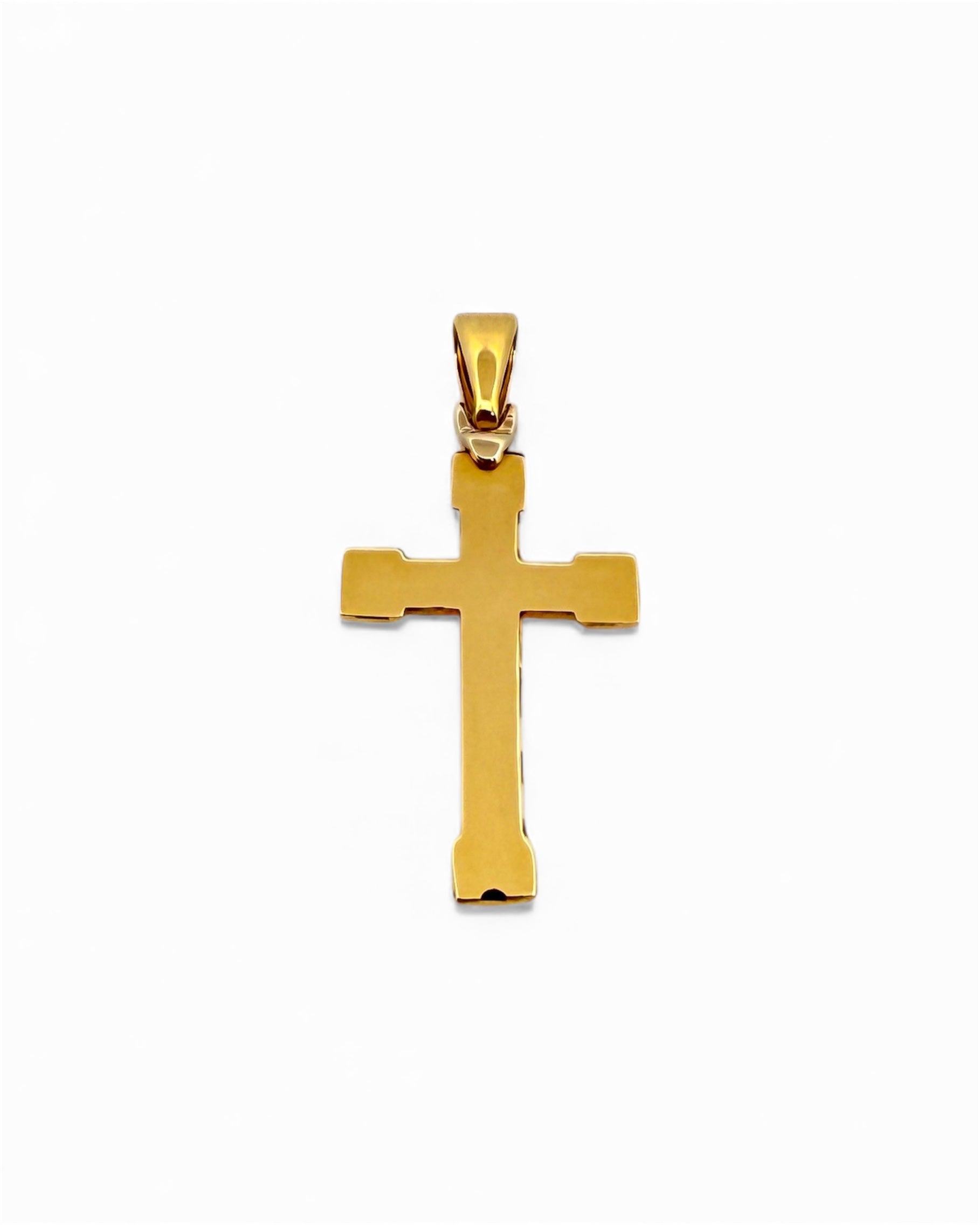 Colgante en forma de Cruz lisa realizada en oro amarillo de 18kt . Mide 3,7cm de largo y 1,6cm de ancho. Cruces de oro 18kt baratas