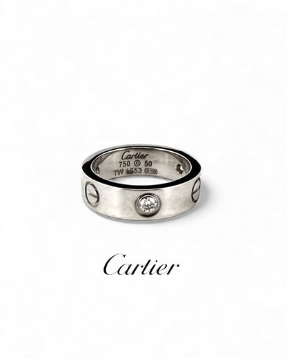 Anillo original de la prestigiosa firma Cartier de la colección LOVE realizada en oro blanco con engaste de 3 brillantes. Joyas Cartier Originales