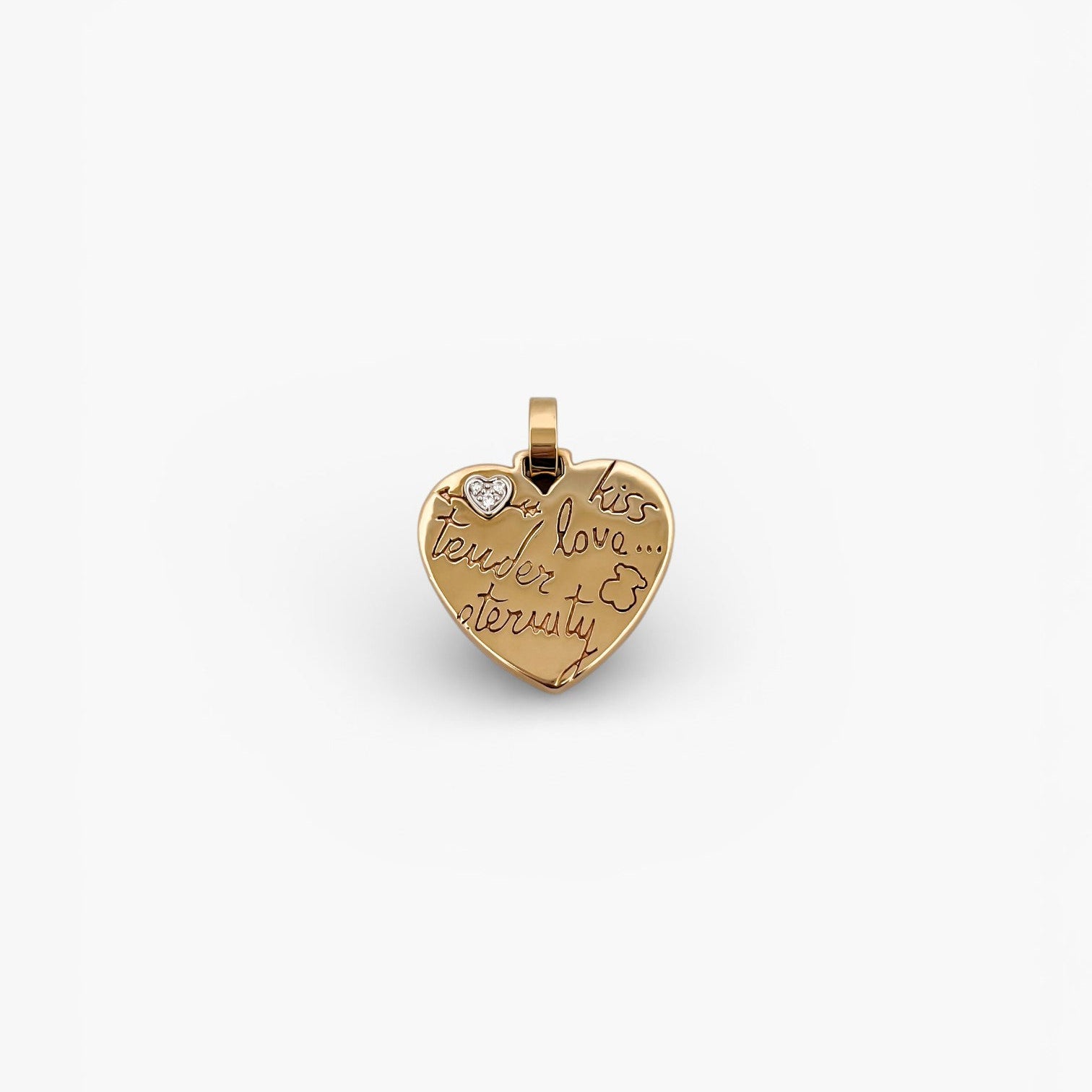 Comprar colgante de la firma TOUS en forma de corazón realizado en oro amarillo de 18kt con un pequeño corazón de diamante en la esquina.Tous en oro amarillo de 18kt. Venta de joyas Tous segunda mano. Ian'Or.