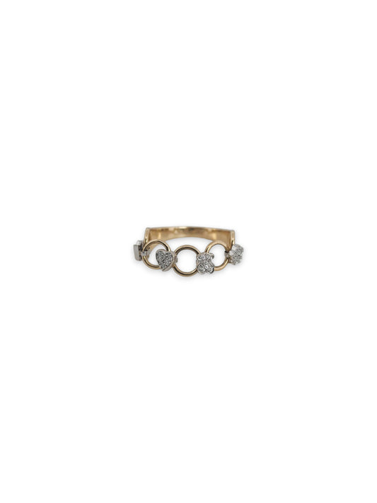 Comprar anillo original de TOUS movil realizado en oro amarillo y con diferentes figuritas como flores, corazones y el iconico oso de la marca, realizados en oro blanco.Joyas Tous baratas.