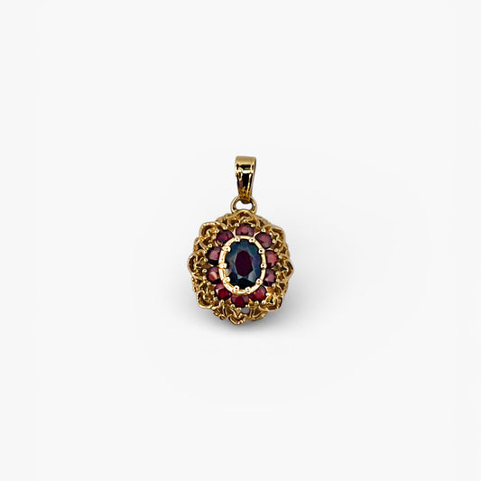 Comprar Colgante realizado en oro amarillo de 18kt con 10 granates, alrededor de un granate central. Joyería Barata en Barcelona.