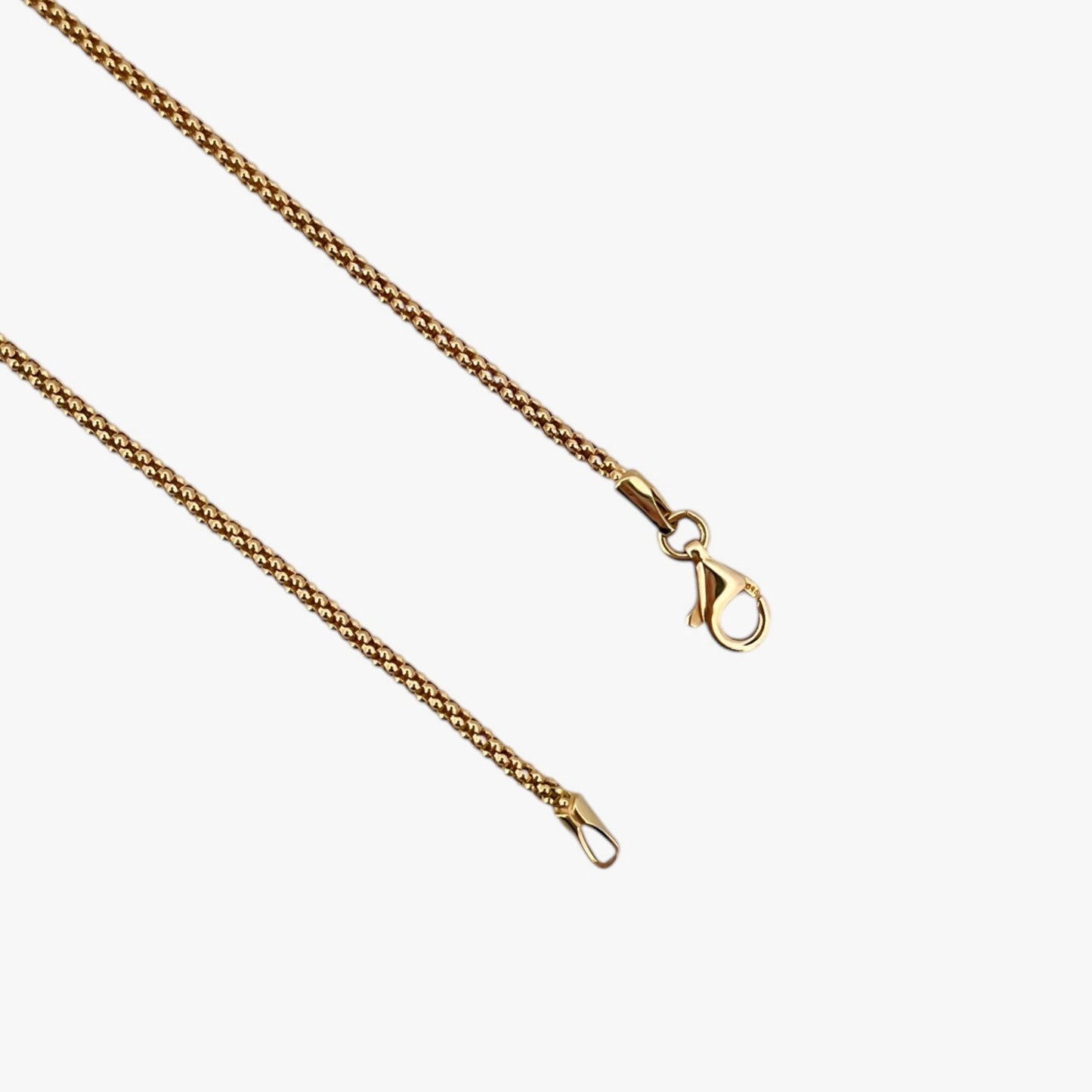 Comprar collar de oro amarillo de 18kt con cadena de cordón malla redonda. La cadena mide 45,5cm de largo y dispone de un cierre tipo mosquetón. Joyería Ian'Or. Envío GRATIS.