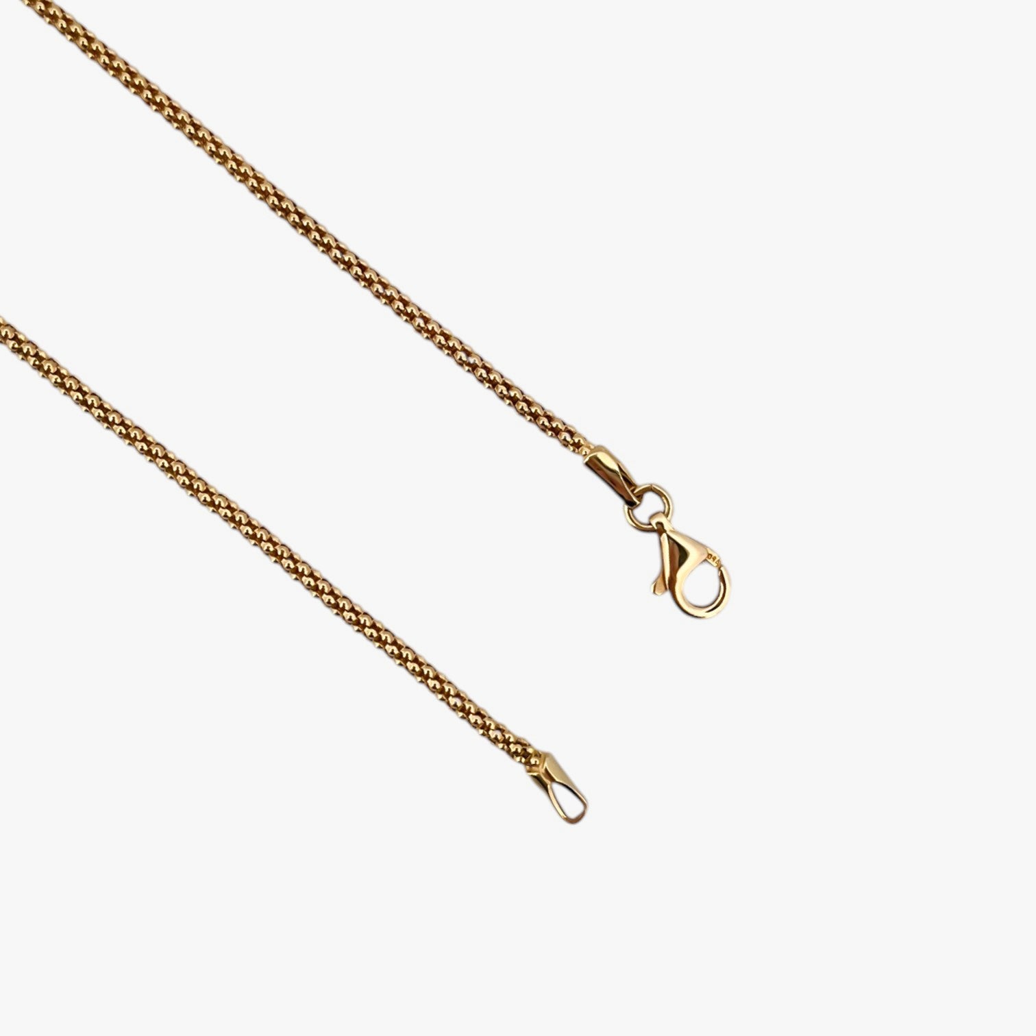 Comprar collar de oro amarillo de 18kt con cadena de cordón malla redonda. La cadena mide 45,5cm de largo y dispone de un cierre tipo mosquetón. Joyería Ian'Or. Envío GRATIS.