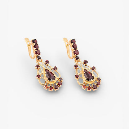 Comprar pendientes largos realizados en oro amarillo de 18kt con 14 granates en cada pendiente. Estos preciosos pendientes disponen de cierre catalán. Joyas vintage. Joyería Ian'Or. Envío GRATIS.