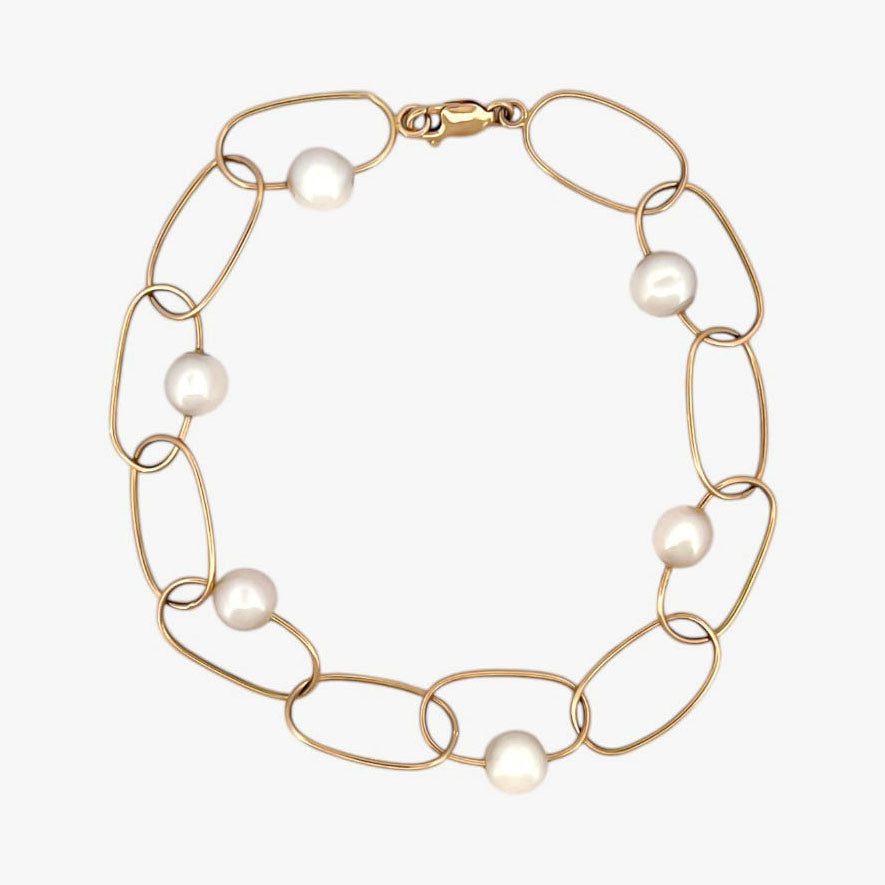 comprar pulsera de Oro amarillo de 18kt con seis perlas y cierre tipo mosquetón. La pulsera mide 22,5cm de largo.