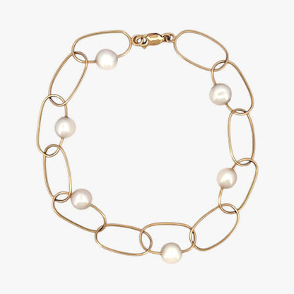 comprar pulsera de Oro amarillo de 18kt con seis perlas y cierre tipo mosquetón. La pulsera mide 22,5cm de largo.