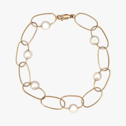 comprar pulsera de Oro amarillo de 18kt con seis perlas y cierre tipo mosquetón. La pulsera mide 22,5cm de largo.