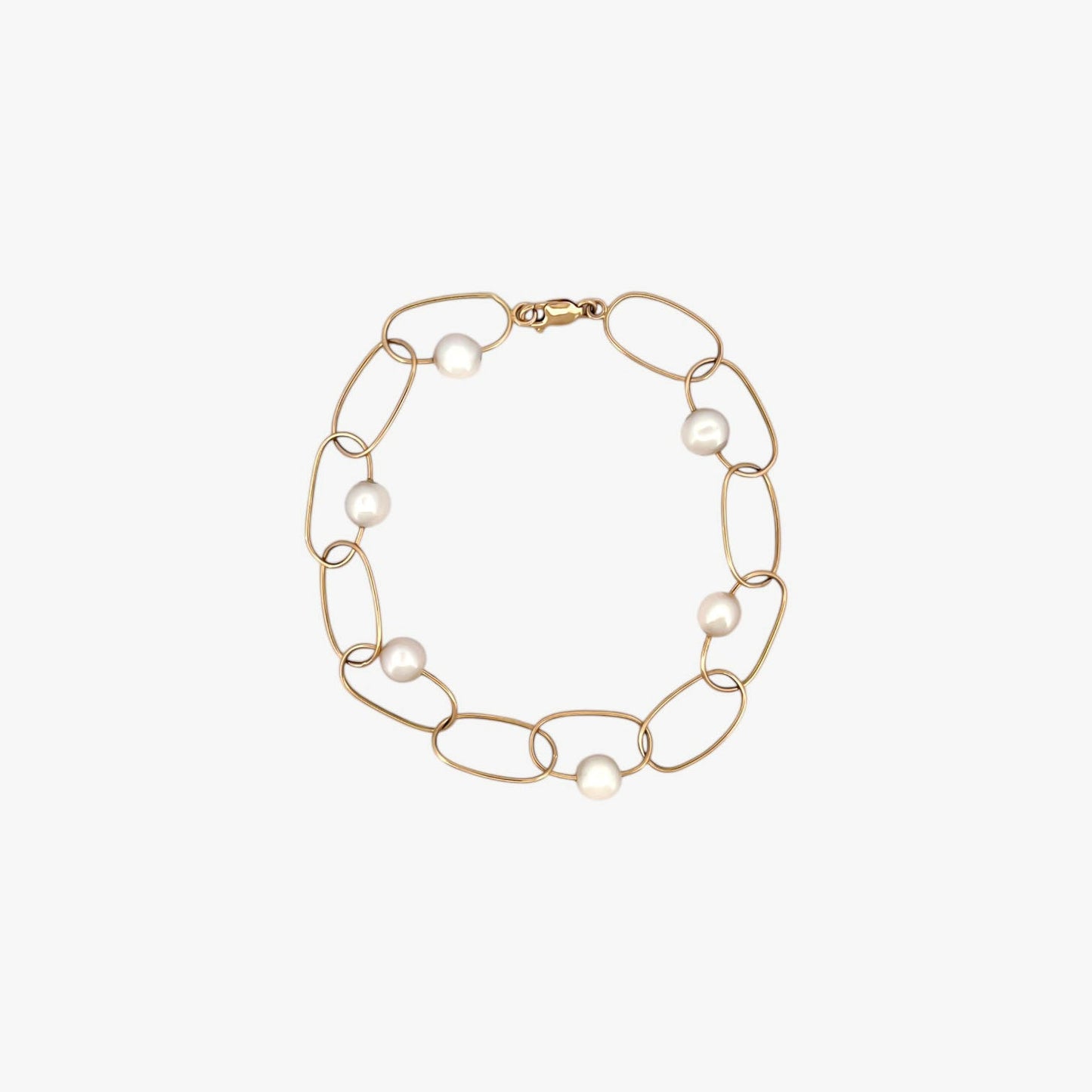 comprar pulsera de Oro amarillo de 18kt con seis perlas y cierre tipo mosquetón. La pulsera mide 22,5cm de largo.