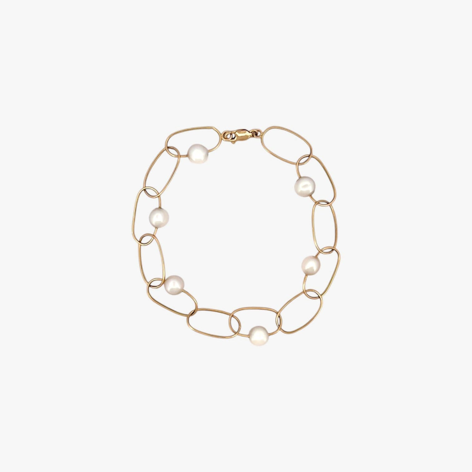 comprar pulsera de Oro amarillo de 18kt con seis perlas y cierre tipo mosquetón. La pulsera mide 22,5cm de largo.
