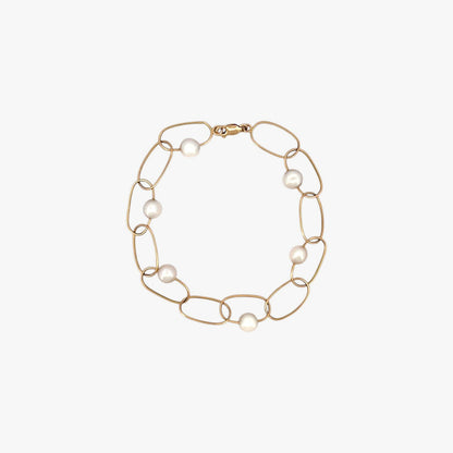 comprar pulsera de Oro amarillo de 18kt con seis perlas y cierre tipo mosquetón. La pulsera mide 22,5cm de largo.