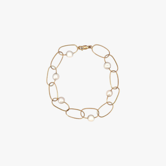 comprar pulsera de Oro amarillo de 18kt con seis perlas y cierre tipo mosquetón. La pulsera mide 22,5cm de largo.