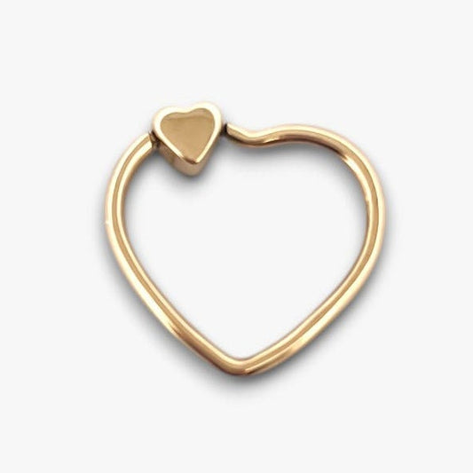 Comprar colgante de la firma TOUS en forma de corazón realizado en oro amarillo de 18kt, con un pequeño corazón de oro amarillo arriba.Tous en oro amarillo de 18kt. Venta de joyas Tous segunda mano. Ian'Or.