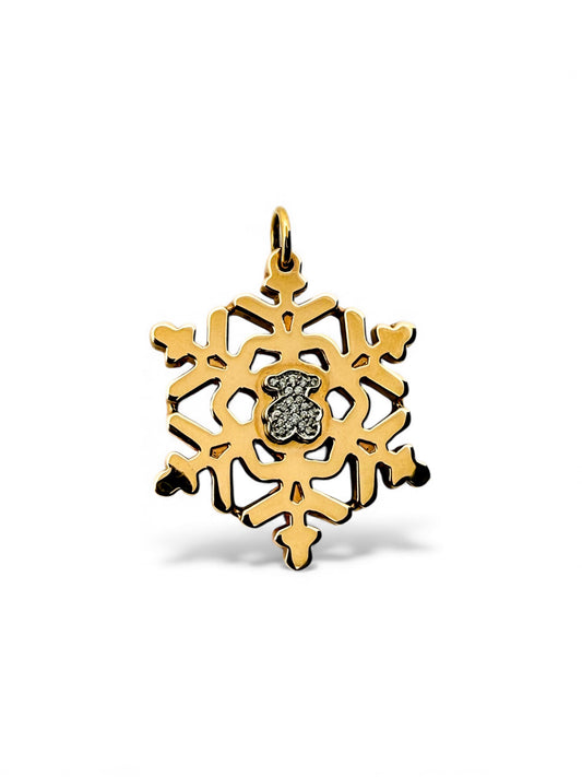 Colgante de la firma TOUS realizado en oro amarillo y blanco de 18kt en forma de copo de nieve y oso en la parte central con pavé de de diamantes. Joyas Tous.

