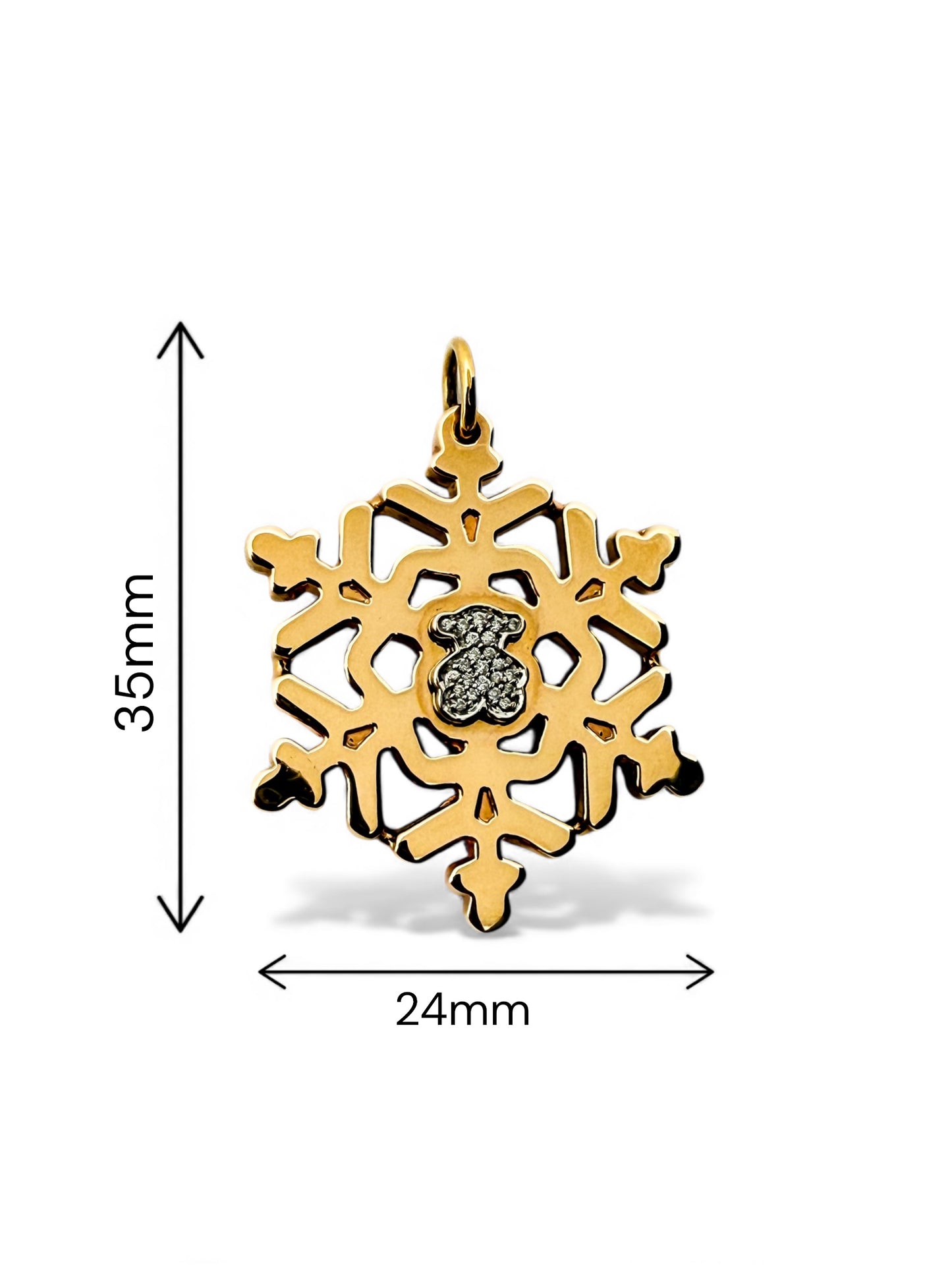 Colgante de la firma TOUS realizado en oro amarillo y blanco de 18kt en forma de copo de nieve y oso en la parte central con pavé de de diamantes. Joyas Tous.

