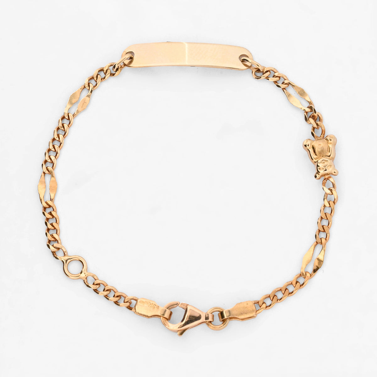 Comprar pulsera de oro amarillo de 18kt con placa central y detalle de osito. Joyeria Ian'Or. Envio gratuito, pieza certificada.