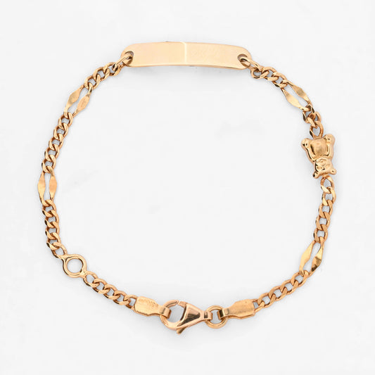 Comprar pulsera de oro amarillo de 18kt con placa central y detalle de osito. Joyeria Ian'Or. Envio gratuito, pieza certificada.