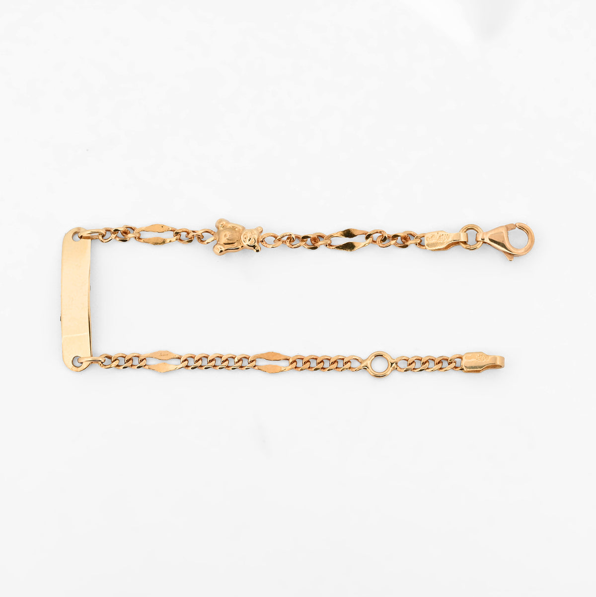 Comprar pulsera de oro amarillo de 18kt con placa central y detalle de osito. Joyeria Ian'Or. Envio gratuito, pieza certificada.