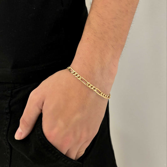 Pulsera oro amarillo de 18kt con cadena alterna barbada. La cadena mide 19,4cm y dispone de un cierre tipo mosquetón. Pulseras de oro 18kt al mejor precio.
