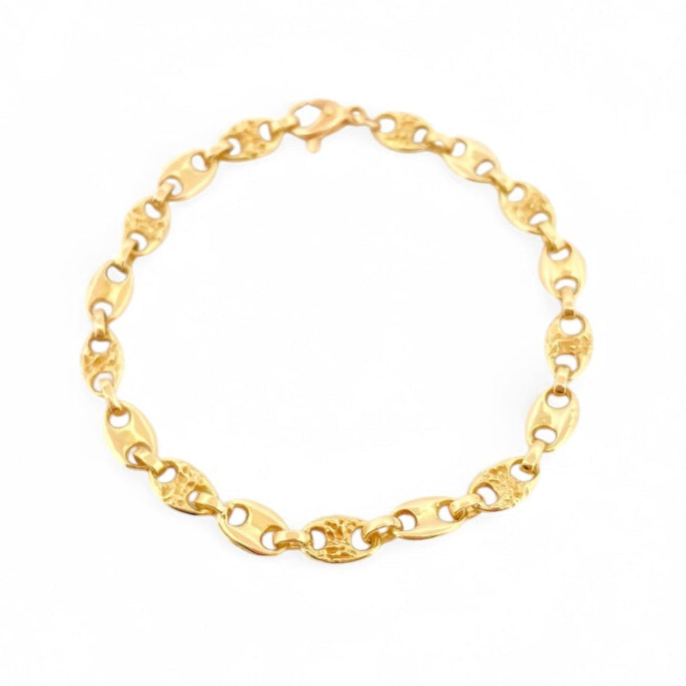 Pulsera de oro de 18kt con cadena tipo calabrote o grano de café intercalada con pieza con textura y pieza lisa de 6,10mm de grosor y medida. Joyería de segunda mano restaurada Barcelona.
