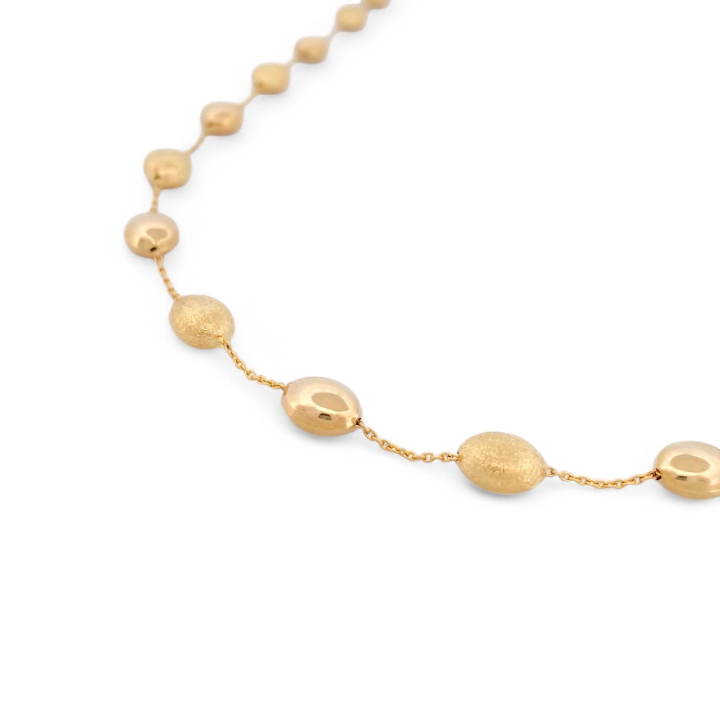 Comprar collar de oro amarillo de 18kt con cadena y bolitas intercaladas lisas y con textura. La cadena mide 44cm de largo. Joyas Barcelona. Joyería Ian'Or. 