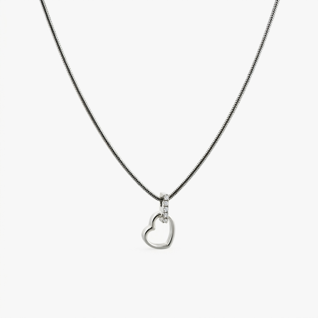 Comprar colgante corazón de oro blanco de 19kt y con balía de brilantes. Joyas corazón de oro al mejor precio.