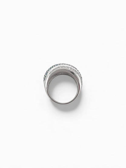 Comprar anillo de tres carriles realizado en oro blanco de 18kt , diamantes talla brillante y topacios. Dos carriles llevan diamantes platas y el del medio topacios