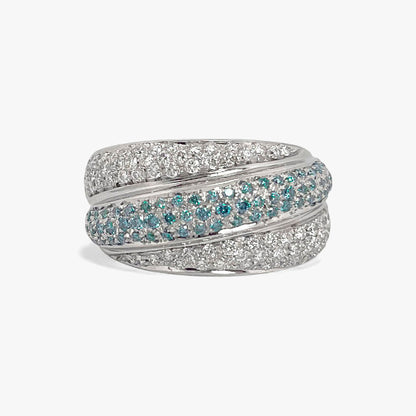Comprar anillo de tres carriles realizado en oro blanco de 18kt , diamantes talla brillante y topacios. Dos carriles llevan diamantes platas y el del medio topacios
