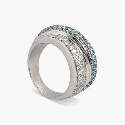Comprar anillo de tres carriles realizado en oro blanco de 18kt , diamantes talla brillante y topacios. Dos carriles llevan diamantes platas y el del medio topacios