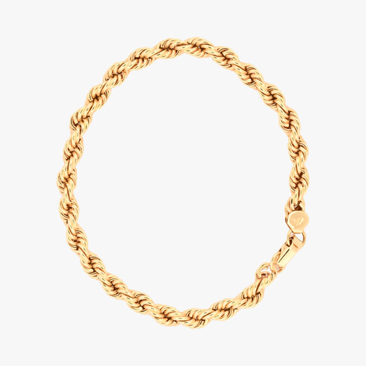 Comprar Pulsera de cordón de oro amarillo de 18kt de 19,5 cm de largo caracterizada por su diseño trenzado en espiral y un cierre de mosquetón. Pulseras de oro 18kt al mejor precio en Barcelona.