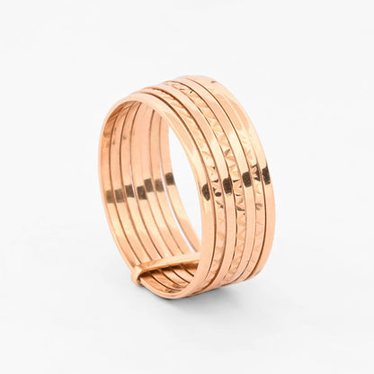 Anillo semanario de siete bandas móviles, combinando alianzas lisas y facetadas de oro amarillo 18kt. Pieza certificada y envío gratuito 