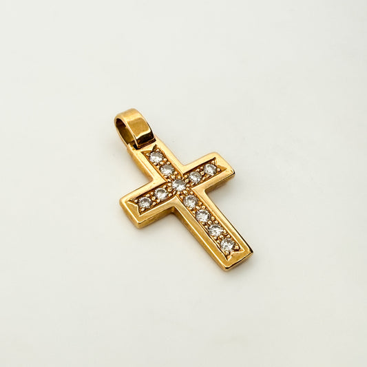 Comprar colgante en oro blanco de 18kt en forma de cruz con un total de 26 diamantes talla brillante. Esta cruz es móvil dándole movimiento al colgante. Ian'Or.

