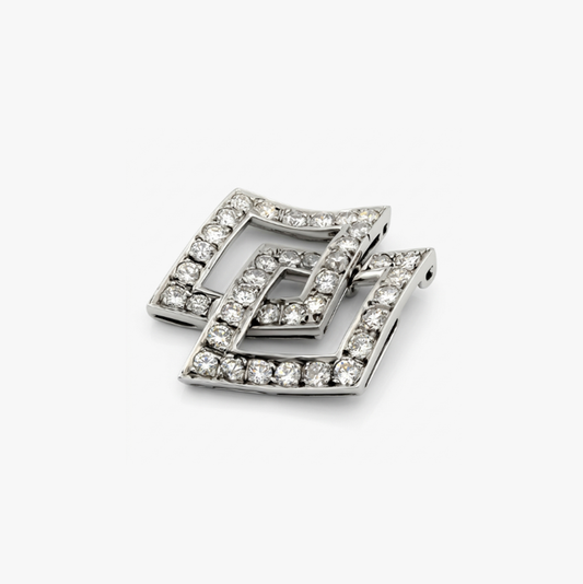 Colgante de dos rombos intercalados en oro blanco de 18kt y diamantes talla brillante. Joyería Compro Oro Barcelona. Ian'Or. Joyas restauradas. Envío gratis.