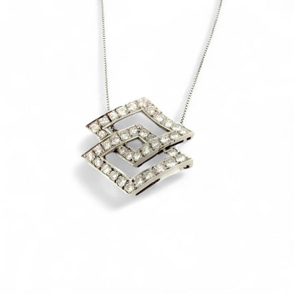Colgante de dos rombos intercalados en oro blanco de 18kt y diamantes talla brillante. Joyería Compro Oro Barcelona. Ian'Or. Joyas restauradas. Envío gratis.
