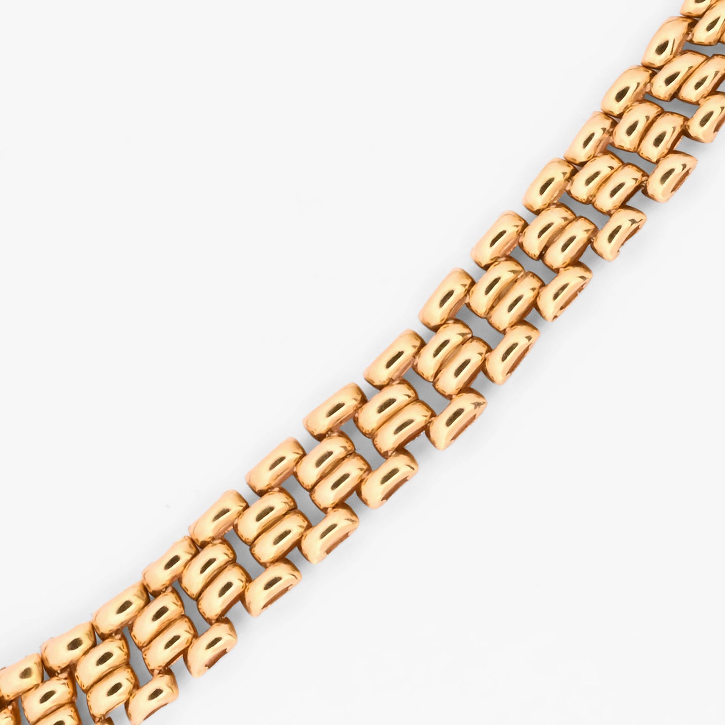 Pulsera tipo malla de oro amarillo 18 kt con un robusto diseño de cuatro filas de eslabones articulados, complementada con una cadena de seguridad. Envío gratis