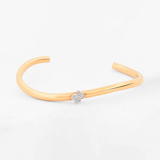 Pulsera rígida abierta tipo esclava de oro amarillo y blanco 18K con el icónico oso de la firma TOUS en pavé de diamantes  Esclavas de oro de 18kt en Ian'Or.