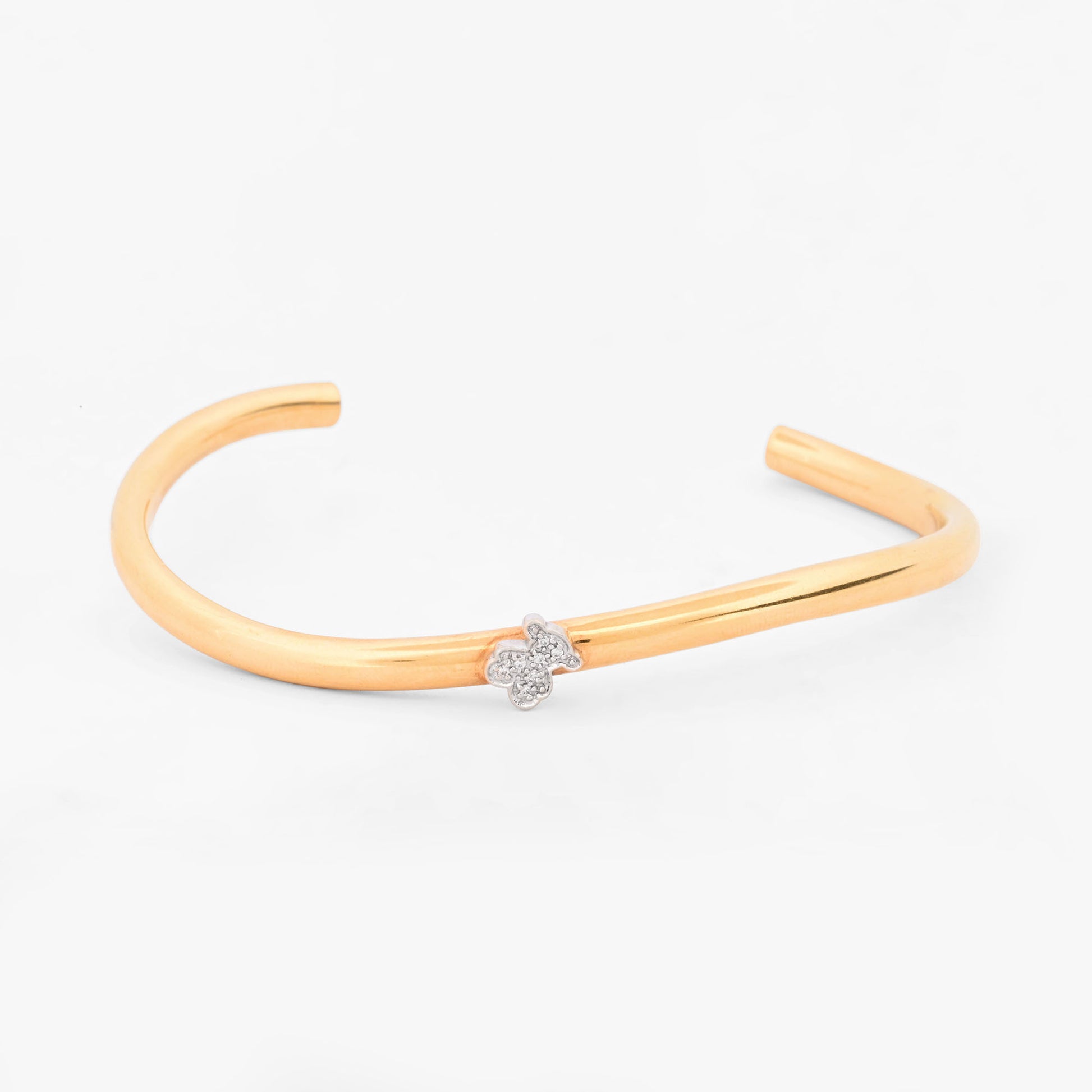 Pulsera rígida abierta tipo esclava de oro amarillo y blanco 18K con el icónico oso de la firma TOUS en pavé de diamantes  Esclavas de oro de 18kt en Ian'Or.