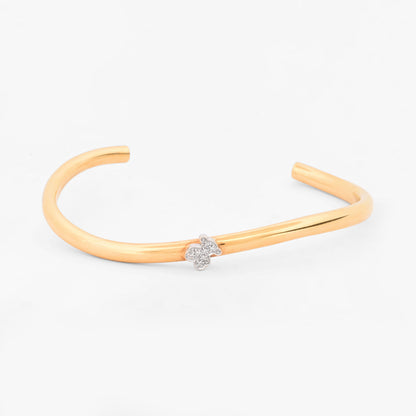 Pulsera rígida abierta tipo esclava de oro amarillo y blanco 18K con el icónico oso de la firma TOUS en pavé de diamantes  Esclavas de oro de 18kt en Ian'Or.