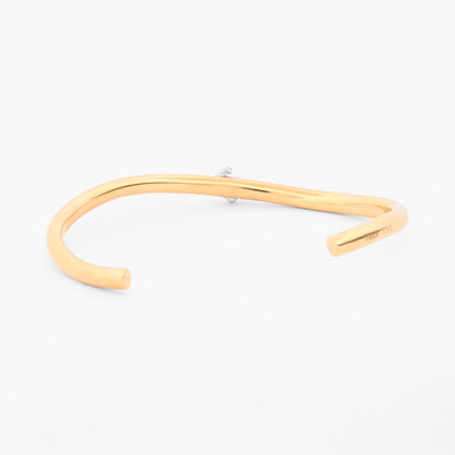 Pulsera rígida abierta tipo esclava de oro amarillo y blanco 18K con el icónico oso de la firma TOUS en pavé de diamantes  Esclavas de oro de 18kt en Ian'Or.