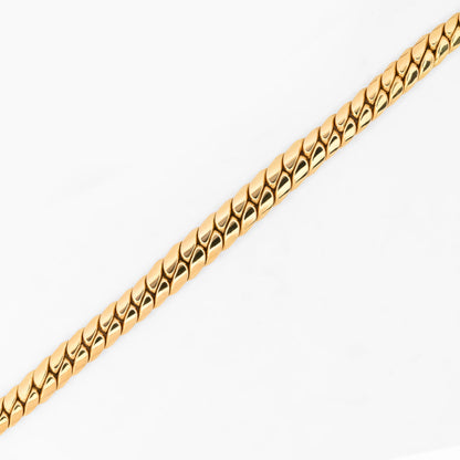 Comprar cadena barbada graduada de oro amarillo 18kt con eslabones planos que aumentan sutilmente su grosor hacia el centro. Envío gratuito pieza certificada.