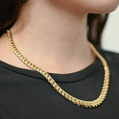 Comprar cadena barbada graduada de oro amarillo 18kt con eslabones planos que aumentan sutilmente su grosor hacia el centro. Envío gratuito pieza certificada.