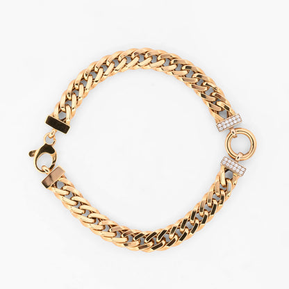Pulsera barbada de oro amarillo 18kt con un motivo central circular flanqueado por barritas pavé de diamantes de xxcts. Pieza certificada y envío gratuito