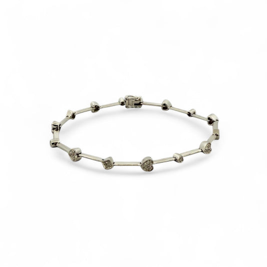 Comprar pulsera semirrígida realizada en oro blanco de 18kt con motivos de corazón, circulo y cuadrado y diamantes talla brillante. Joyas de segunda mano. 